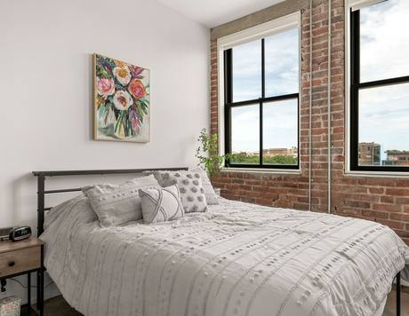 A one-bedroom home, original brick and all