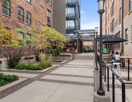 The courtyard walkway, with the building's original steel fire escape